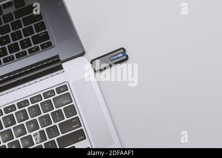 Close Up VIew of USB Stick Plugged Into Laptop Port Stock Photo