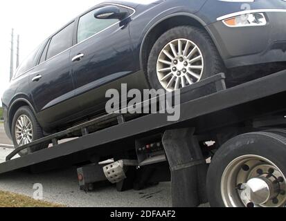 Car towed on a flatbed truck Stock Photo