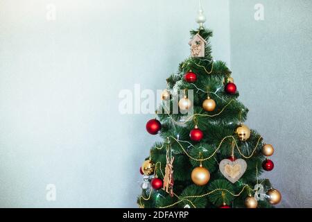 Christmas tree in the house. Wooden toys. Christmas toys. eautiful fir Stock Photo