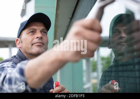 close view of man cleaning windows Stock Photo