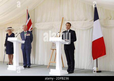 French President Emmanuel Macron (R) speaks at a wreath-laying event at Carlton Gardens in central London on June 18, 2020 with Britain's Prince Charles, Prince of Wales (2L) and Britain's Camilla, Duchess of Cornwall (L) during a visit to mark the anniversary of French president Charles de Gaulle's appeal to French people to resist the Nazi occupation during WWII. - Macron visited London on June 18 to commemorate the 80th anniversary of former French president Charles de Gaulle's appeal to French people to resist the Nazi occupation during World War II. Photo by Tolga AKMEN/Pool/ABACAPRESS.CO