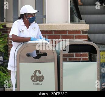 NO FILM, NO VIDEO, NO TV, NO DOCUMENTARY - A Walt Disney World cast member sanitizes public areas at the Disney Springs shopping and dining district in Lake Buena Vista, FL, USA, Wednesday, June 17, 2020. The Florida Department of Health reported 3,207 new cases of Covid-19 on Thursday, marking a record daily high for Florida since the pandemic began. Photo by Joe Burbank/Orlando Sentinel/TNS/ABACAPRESS.COM Stock Photo