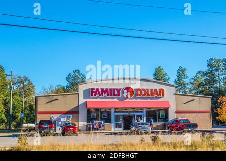 Augusta, Ga USA - 12 03 20: Family Dollar retail store with people and cars blue sky Stock Photo