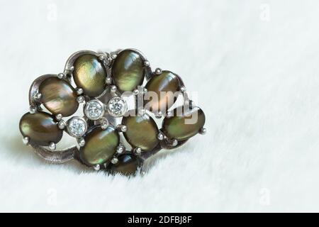 Green Stones On A Silver Ring Stock Photo