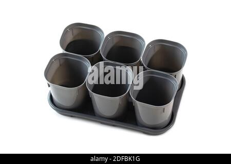 Empty plastic plant pots isolated on white background Stock Photo