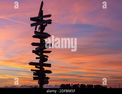 Handmade international directional sign post along US Highway 27 at the Showcase of Citrus in Clermont, Florida. (USA) Stock Photo