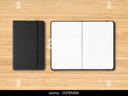Black closed and open lined notebooks mockup isolated on wooden background Stock Photo