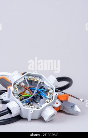 Components for use in electrical installations, junction box, cables and tools Stock Photo