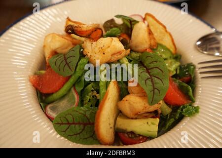 Close up Classic Caesar dressing salad with parmesan crostini and giant tiger river prawn Stock Photo