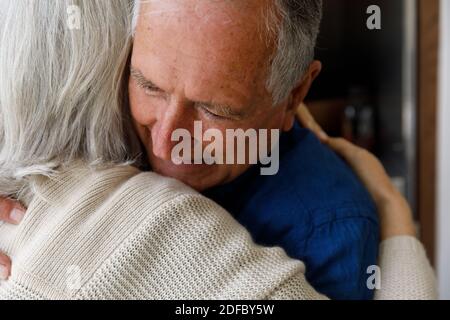 Close up view of senior caucasian couple dancing together in the kitchen at home Stock Photo