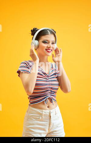 Young asian woman in headphones Stock Photo