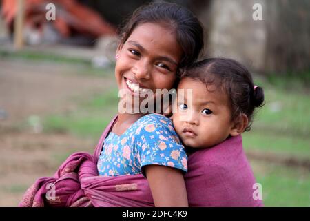 Nepal, portrait of Nepalese girl with her sister in Pokhara Stock Photo