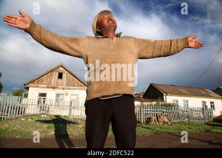 Kyrgyzstan, portrait of a man in the village of Tamga in front of his house Stock Photo