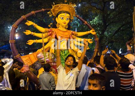 India, people and crowd during Durga puja celebration in Kolkata Stock Photo