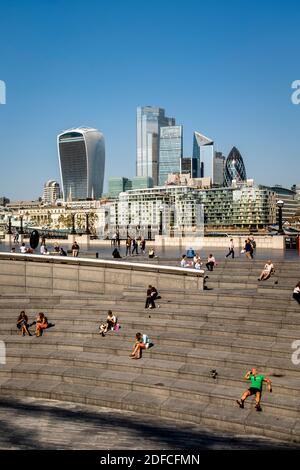 People Enjoying Their Lunch Break At The Scoop, London Bridge City Area, London, UK. Stock Photo