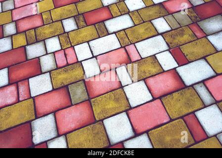 Golden, pink and white mosaic tiles. Stone tiled floor Stock Photo