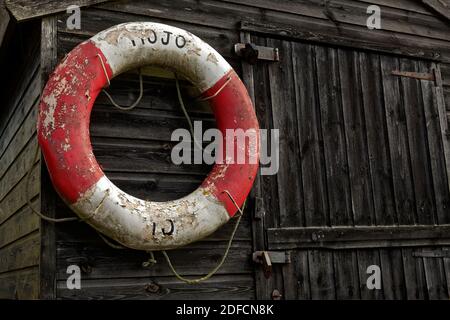 Old life ring on a Fisherman's shed Stock Photo