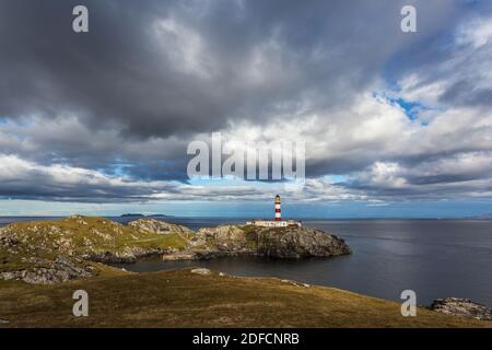 Eilean Glas Lighthouse on a summer day with moving clouds above Stock Photo