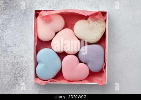 Heart shaped macarons in gift box for Valentine's Day, pastel colors Stock Photo