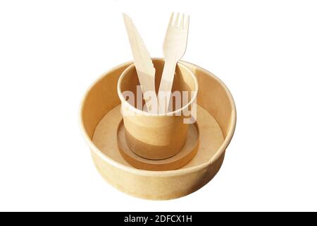 Paper plate and cup with wooden knife and fork from a takeaway restaurant. Disposable eco friendly. Isolated on a white background. Netherlands Stock Photo