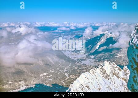 North-east view from Zugspitze mountain into Loisach valley with Garmisch-Partenkirchen in winter Stock Photo