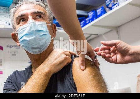 Flu vaccination in a pharmacy, France, October 2020. Stock Photo