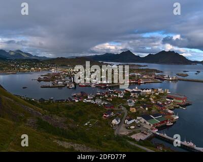 Beautiful aerial view of fishing village Ballstad located on small island on Vestvågøya, Lofoten, Norway with harbor, docks, boats, warehouses. Stock Photo