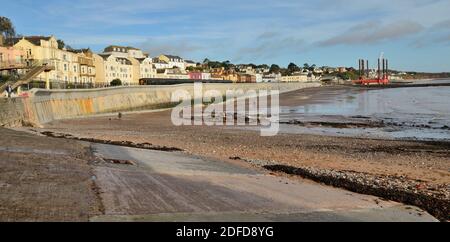 The new seawall at Dawlish after being rebuilt in 2020, looking towards the railway station from Boat Cove at low tide. (See note). Stock Photo