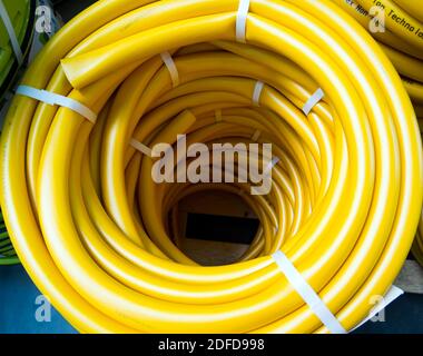 Voronezh, Russia - February 29, 2020: New watering hose coiled up top view Stock Photo