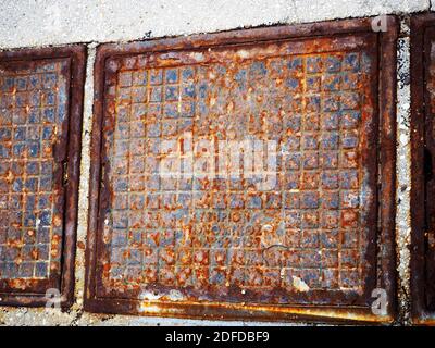 Partially-rusty metal man-holes, Greece Stock Photo