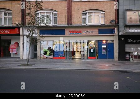 2 December 2020 - Harrow, UK: Facade of Tesco Express store with copyspace below Stock Photo