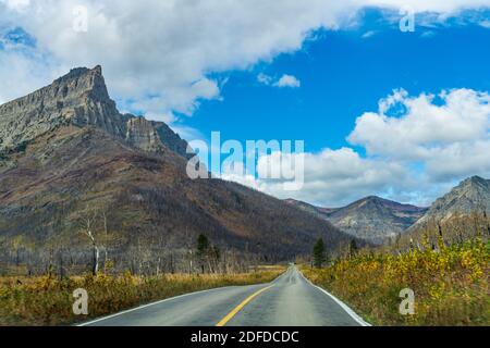 Red Rock Canyon Parkway in autumn sunny day morning. Waterton Lakes National Park, Alberta, Canada. Stock Photo