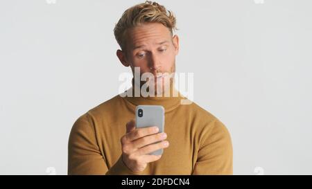 Modern mobile technology, advertising, app concept. A smiling young ...