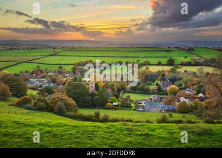 View in autumn over the village of Corton Denham and countryside at sunset, Corton Denham, Somerset, England, United Kingdom, Europe Stock Photo
