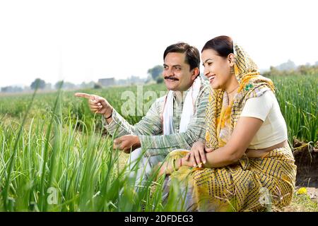 Rural Indian couple in agricultural field Stock Photo - Alamy