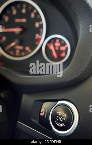 GRODNO, BELARUS - JUNE 2020: BMW X3 II F25 xDrive Selective focus on red enlightened Car Start Stop Engine Button. Element of interior inside car Stock Photo