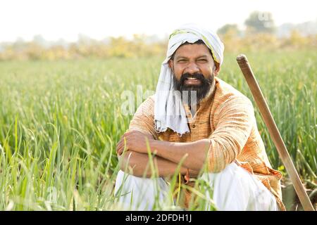 Happy Indian farmer in agricultural field outdoor Stock Photo