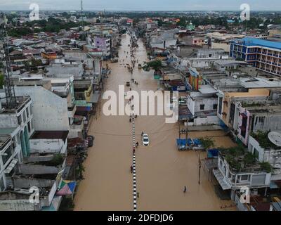 Medan. 4th Dec, 2020. Aerial photo taken on Dec. 4, 2020 shows a flooded street after overnight heavy rain in Medan, North Sumatra, Indonesia. Credit: Dalimunte/Xinhua/Alamy Live News Stock Photo