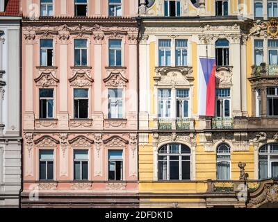 Classic Bohemian town house architecture adored with the national flag of the Czech Republic in the historic Prague city centre. Stock Photo