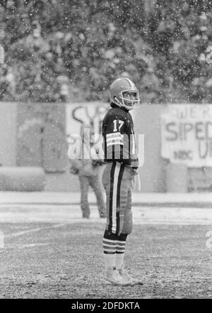 Cleveland Browns quarterback Brian Sipe takes a break during a snowfall at  a late season game at Cleveland Stadium in December, 1980. The Browns,  known then as the Karciac Kids, won the