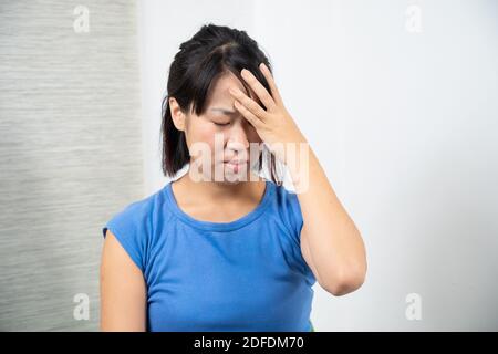 Asian woman having headache. Stock Photo