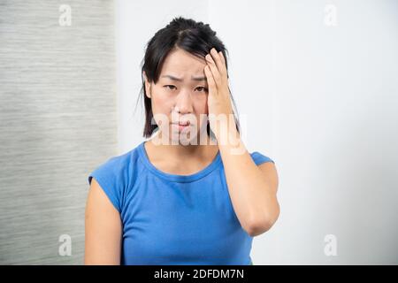 Asian woman having headache. Stock Photo