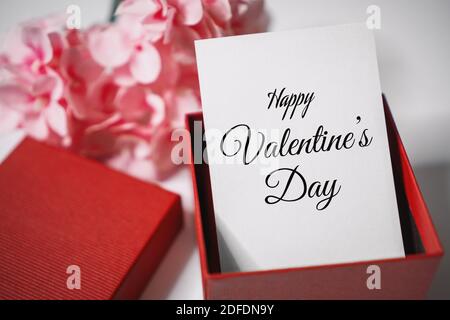 Happy Valentine's Day. Paper Card in Gift Box. Love and Romance Concept. Stock Photo