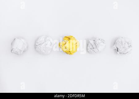 Unique Yellow Crumple Paper In Line With Others. Business Concept. Stock Photo