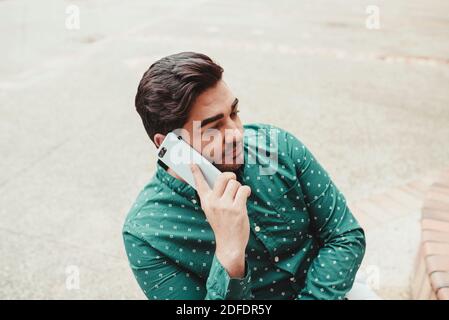Handsome man talking on the smartphone Stock Photo