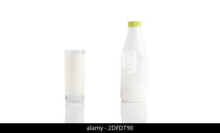 A glass of milk with a plastic milk bottle isolated on a white background,kefir, dairy product. Stock Photo