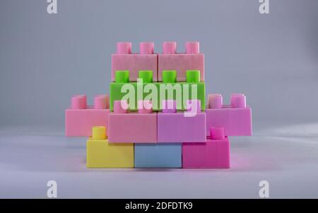 stacked toy blocks on a white background Stock Photo