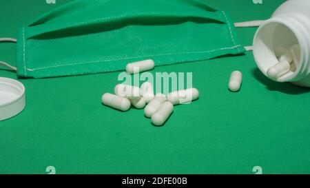 Capsules,medical tablets,empty plastic white jar for text,closeup. Stock Photo