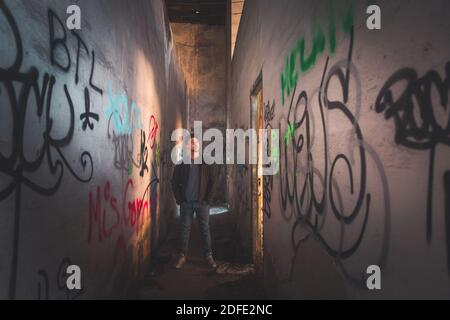 Young caucasian man posing in a abandoned pavilion. Stock Photo