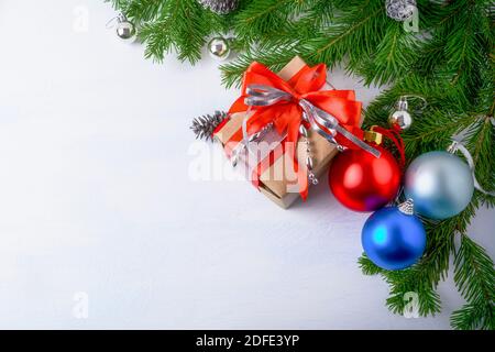 Christmas background with gift box and ornaments, copy space. Christmas background top view copy space. Stock Photo